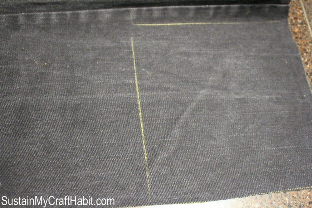 Fabric chalk lines of a section of grey denim