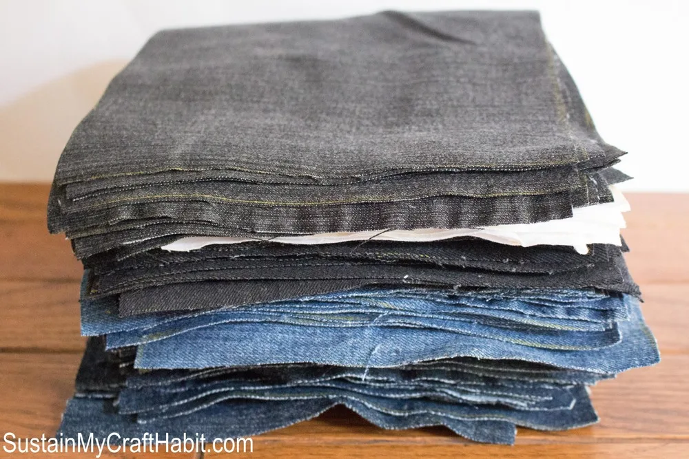 Stack of cut-out denim squares prior to sewing the picnic blanket