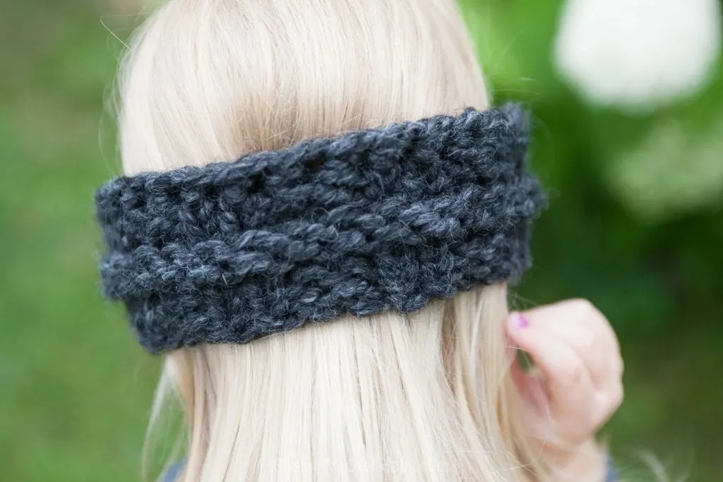 Back view of a child's knitted headband from a free knitting pattern