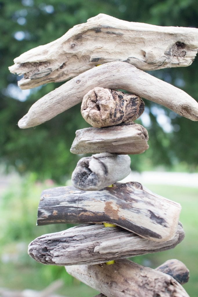 Close up image of variations in driftwood pieces at the top of a DIY driftwood Christmas tree