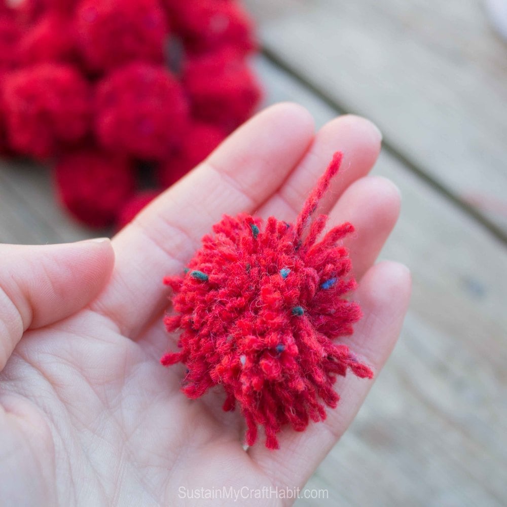 An unruly pom pom removed from the fork.