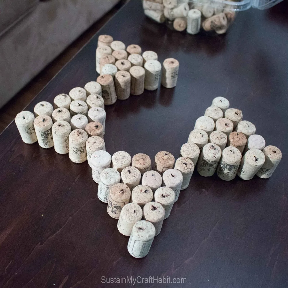 Arranging the wine cork triangles to form a star shape