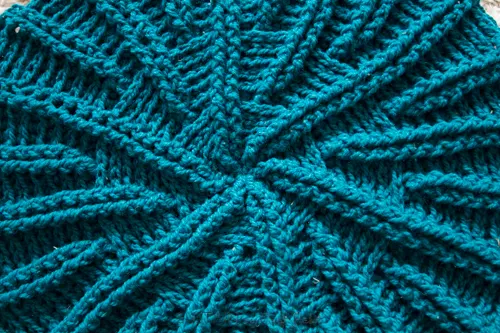 Close up image of the radial pattern on the round crochet throw pillow pattern