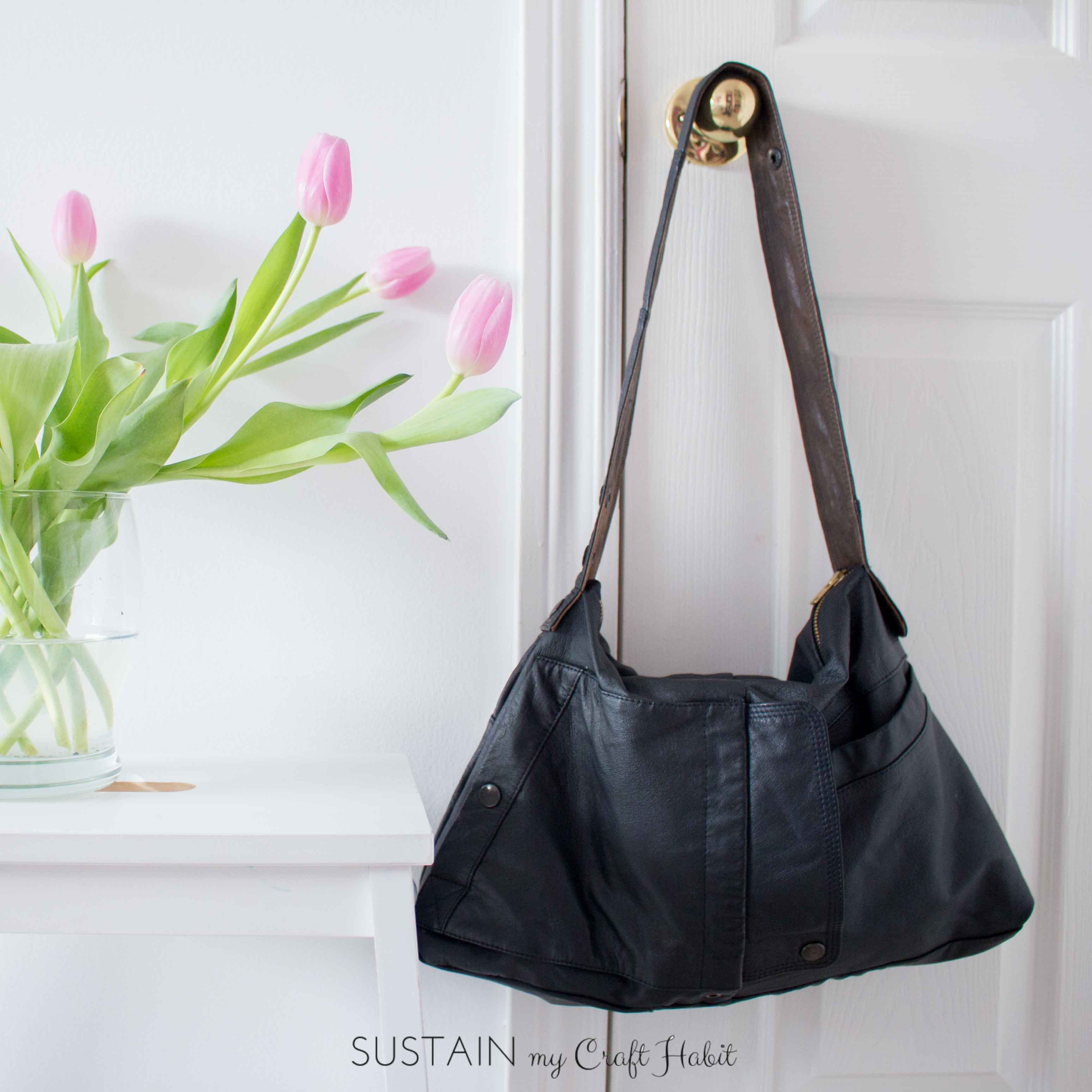 A dated leather jacket gets a new purpose in life as a useful, edgy and beautiful new DIY bag. This one-of-a-kind upcycled handbag is a great weekend sewing project. The detailed step-by-step tutorial is included.