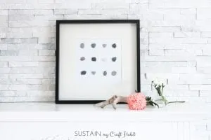 DIY wall art. Make beautiful and natural art for your wall simply with stones and glue. A lovely DIY home decor idea for your coastal or rustic home. Click through for the tutorial.