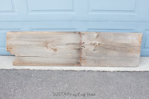 Original piece of barn board purchased at an antique shop to make a DIY console table with