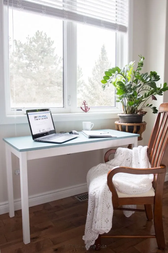 A little paint gives new life to an old wooden table and inspires a fresh and cozy office nook. Full tutorial on painting yellowing furniture.