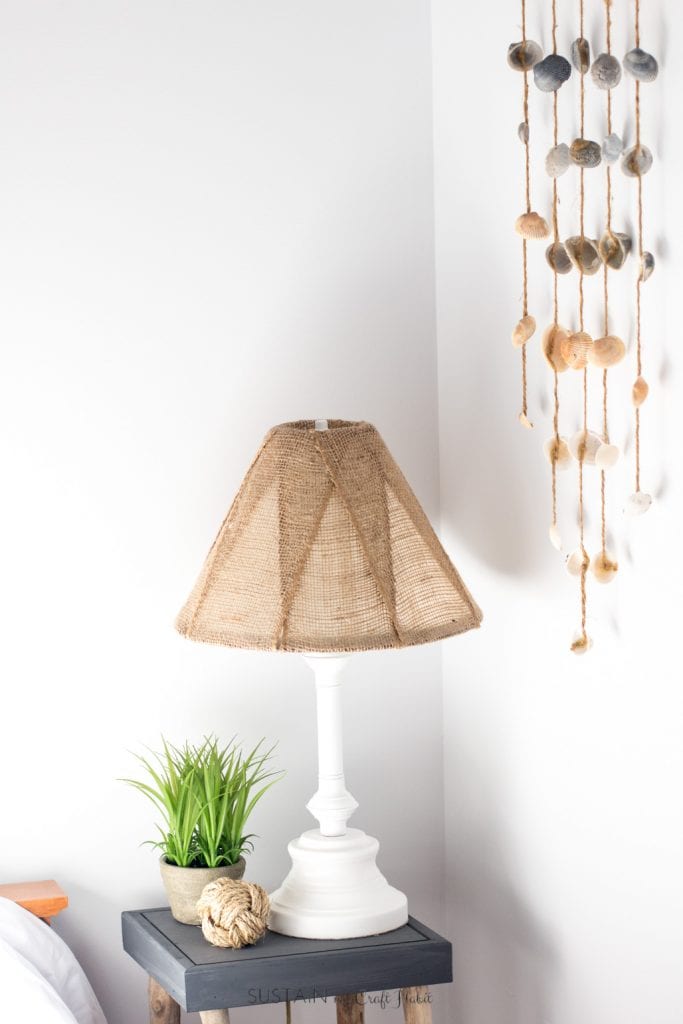 Learn how to makeover an old brass lamp base and outdated shade simply using some spray paint and burlap ribbon.