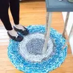 Learn how to crochet a large circular rug without any hooks using upcycled t-shirts!