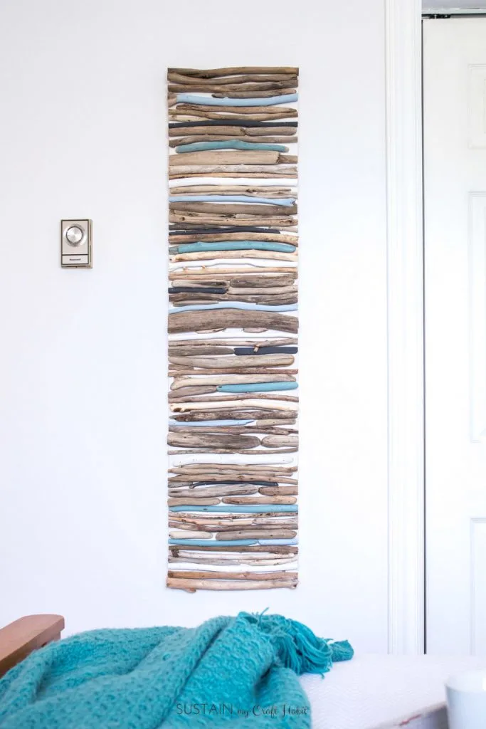 DIY wall art made with painted pieces of driftwood