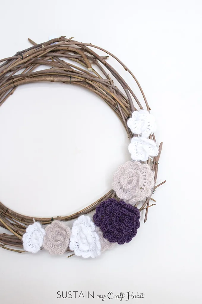 Make your own wreath for the spring and summer using branches from your yard. Free crochet flowers pattern too!