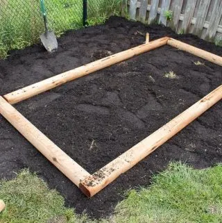 How to build a simple raised garden bed. Easy DIY project for making a vegetable or flower box in your backyard.