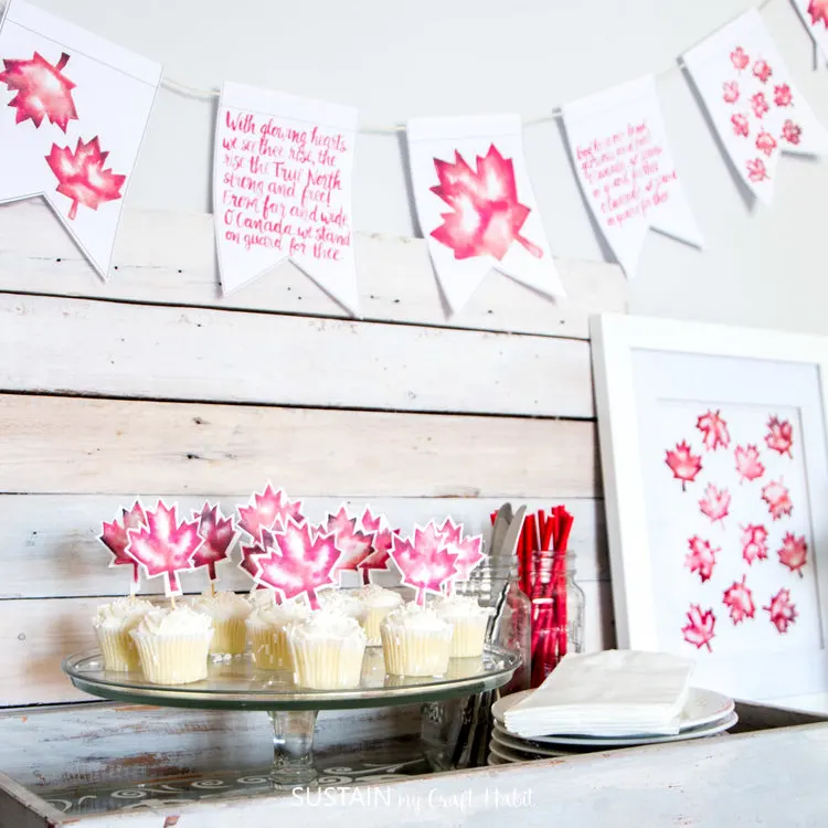 Celebrate Canada Day with this red and white. Grab free printable banners, cupcake toppers and art.