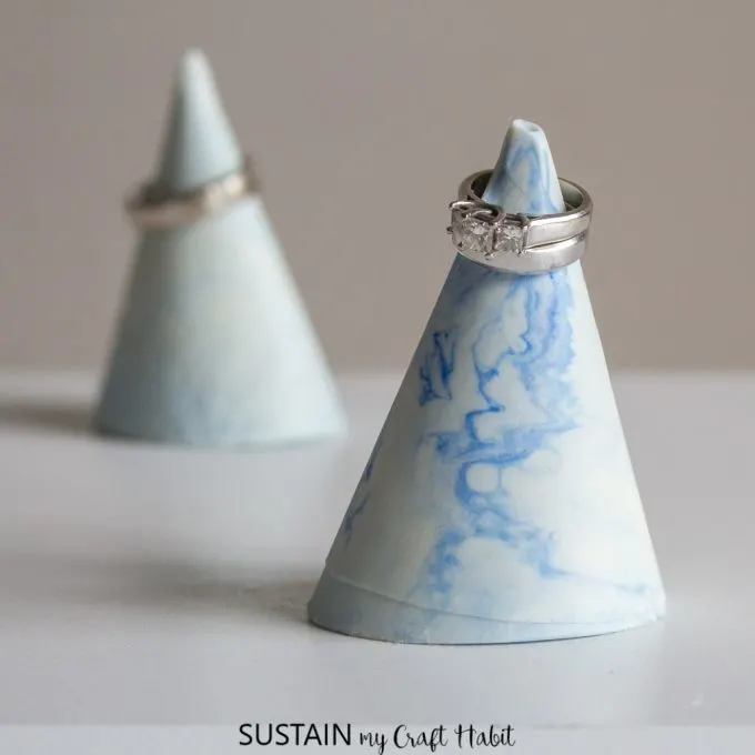 Learn how to make these gorgeous faux-marble ring cones with a DIY silicone mold! Fun jewelry organization idea.