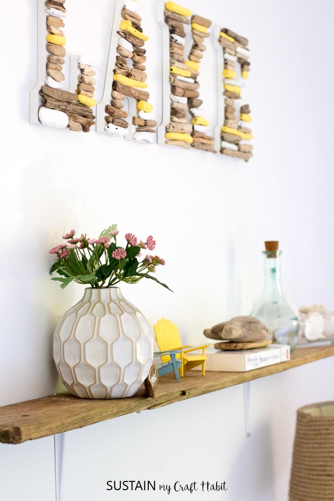 Make a simple, rustic DIY shelf with driftwood! Perfect home decor accessory for the lakehouse or cottage. DIY live edge shelf.