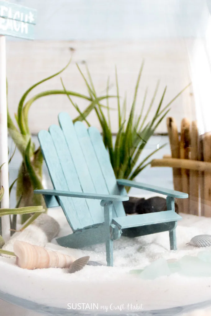 DIY mini Adirondack chairs that are perfect for a beach-themed fairy garden. Video tutorial included!