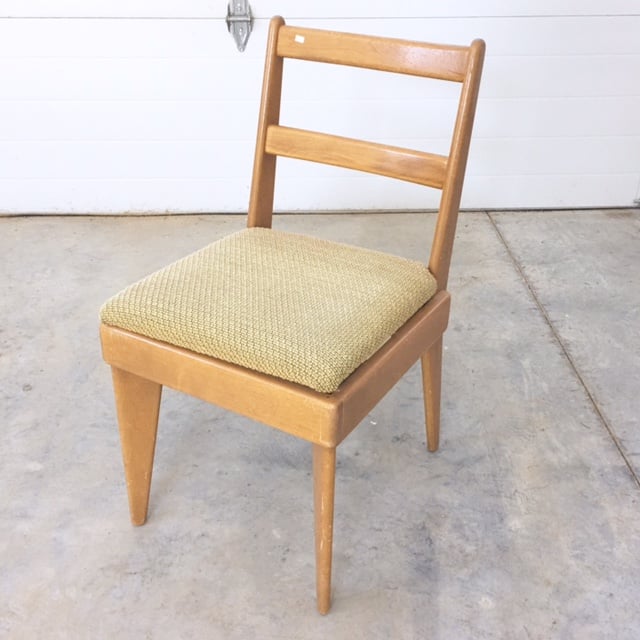 Thrifted mid-century modern chair get a reupholstered seat for a fresh coastal feel.