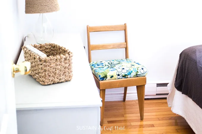 Reupholstered wood chair for a beach themed bedroom makeover.