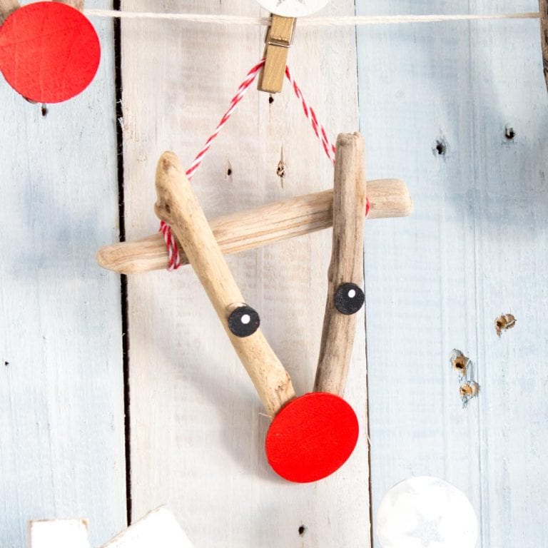 Adorable driftwood reindeer ornament as a beach house decorating idea