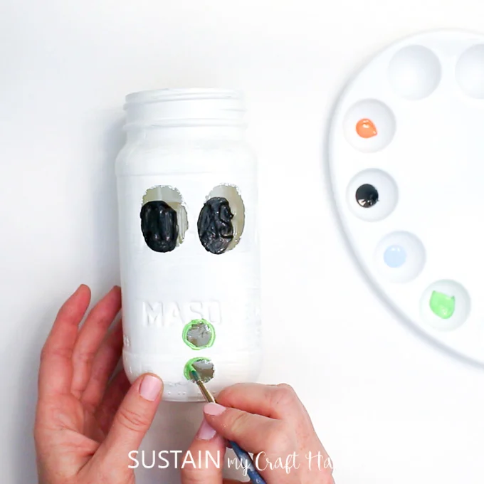 Painting green buttons onto this Mason Jar craft idea
