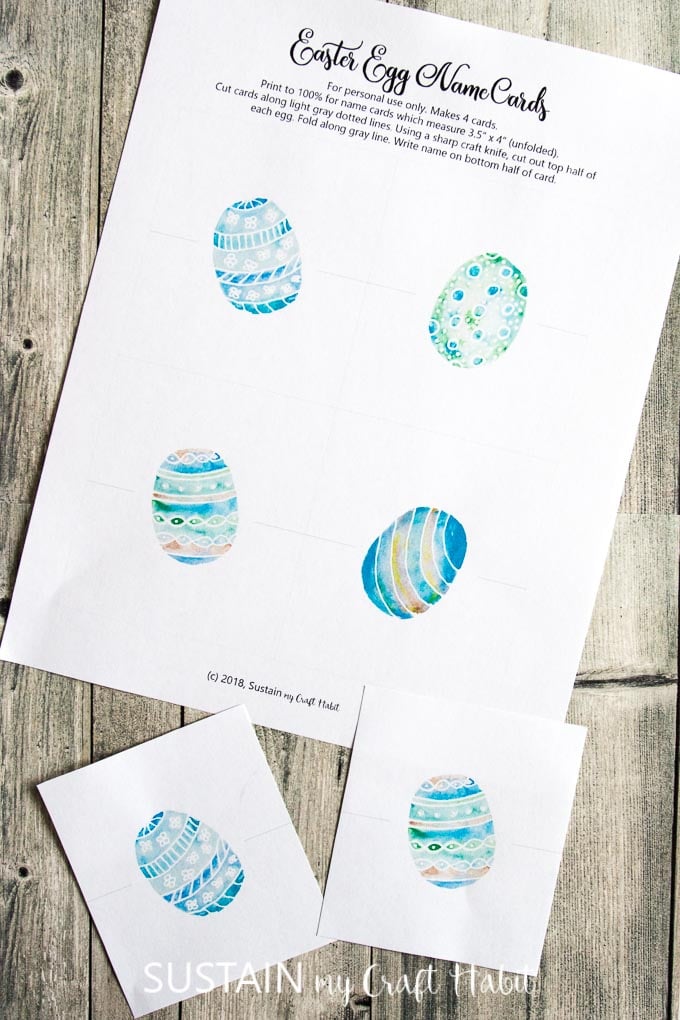 Printable Easter place cards template on a wooden backdrop