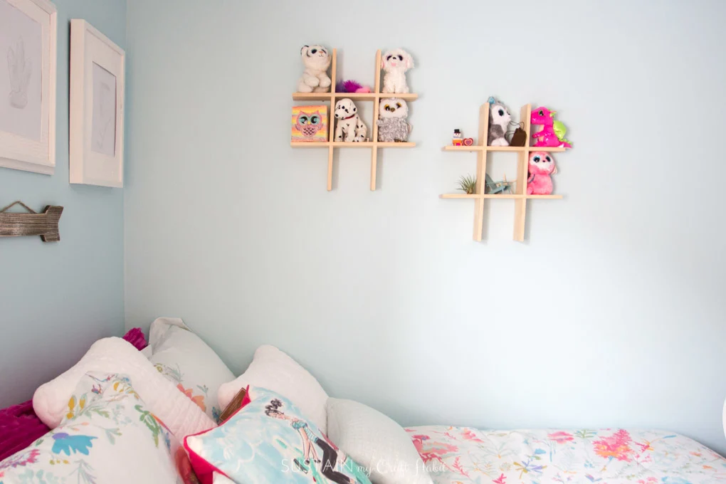 Beenie boo storage idea on small wall shelves above a bed
