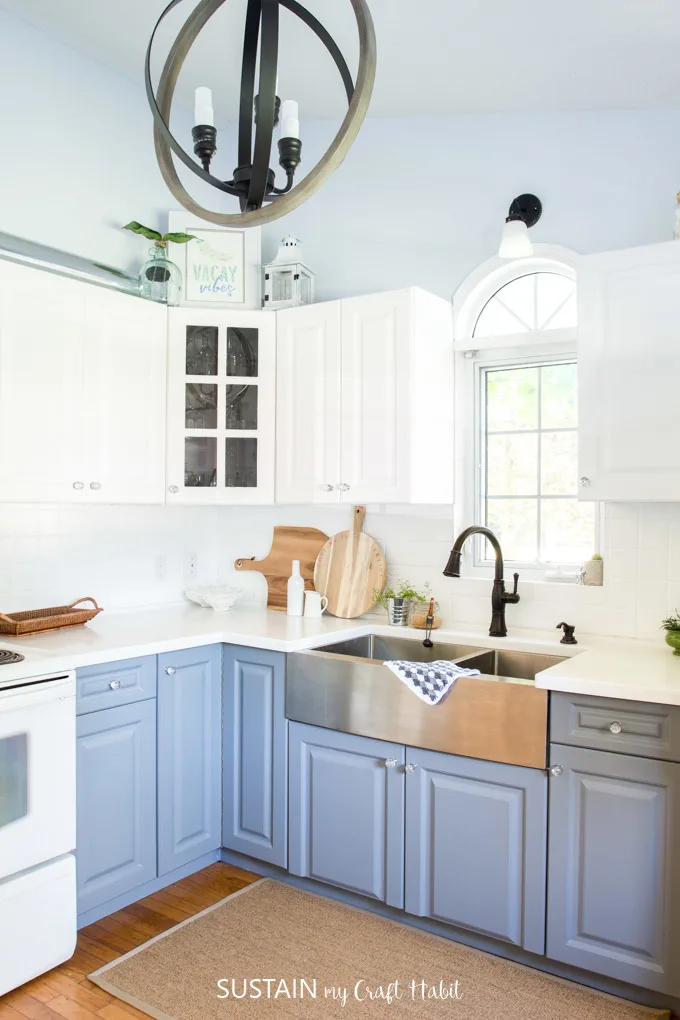 Newly renovated modern coastal kitchen with two-tone cabinets included refinished kitchen back splash.