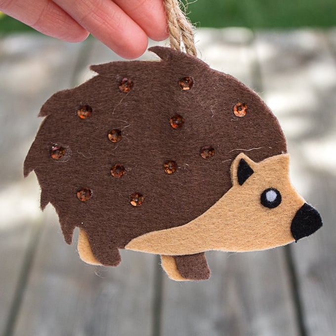 A baby porcupine felt ornament with sequins