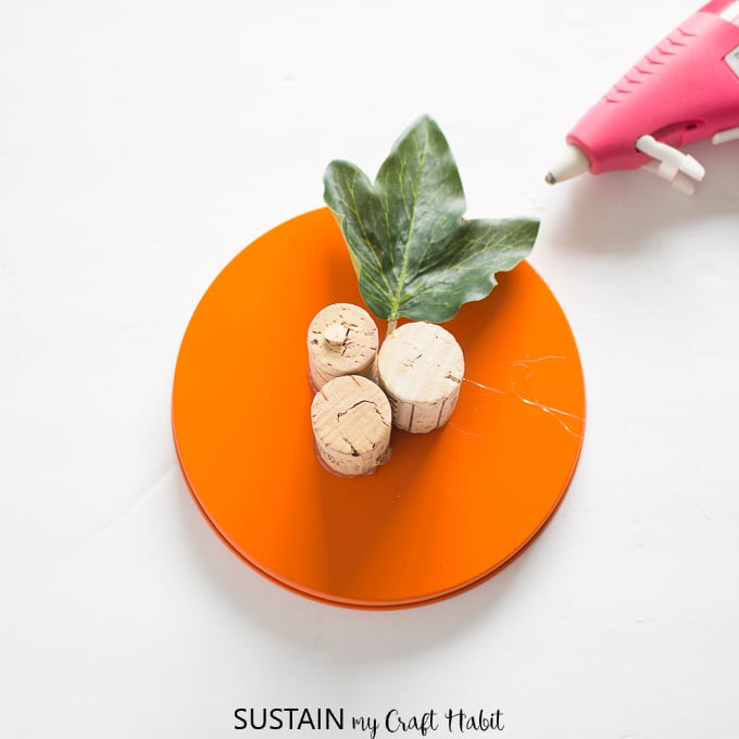 Using wine corks to make a stem for an upcycled cookie tin pumpkin