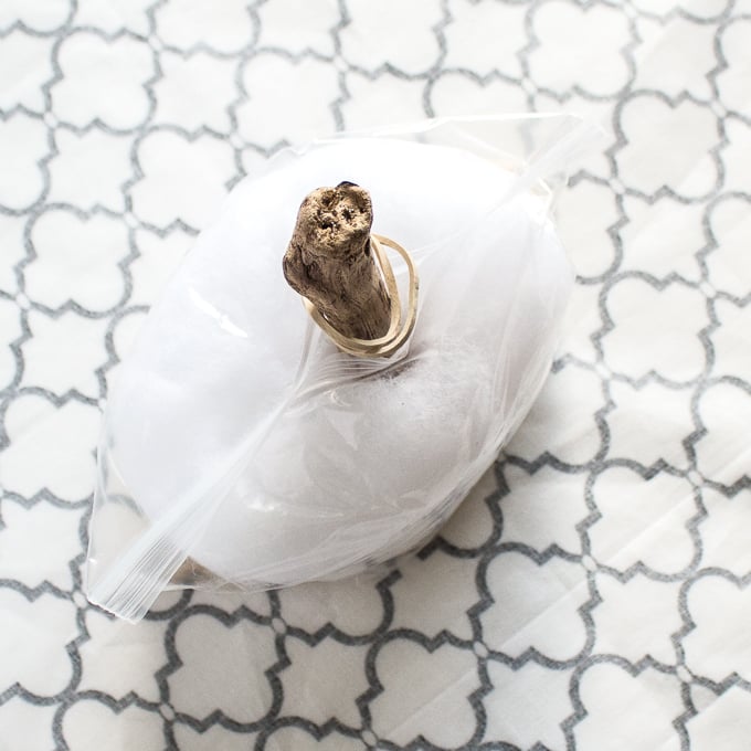 Lay the fabric circle with right side facing down and place the filled bag in the center.