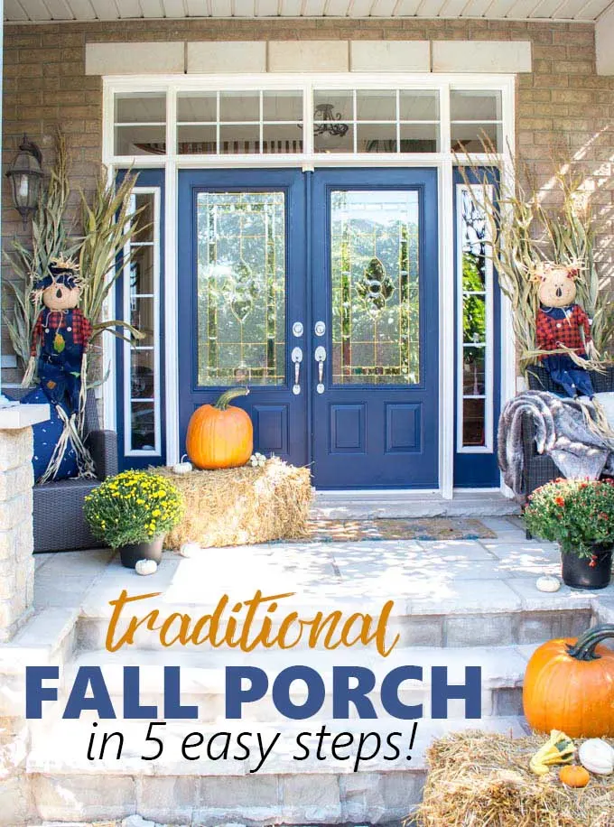 A front porch with blue doors decorated for fall with traditional hay, scarecrows and pumpkins