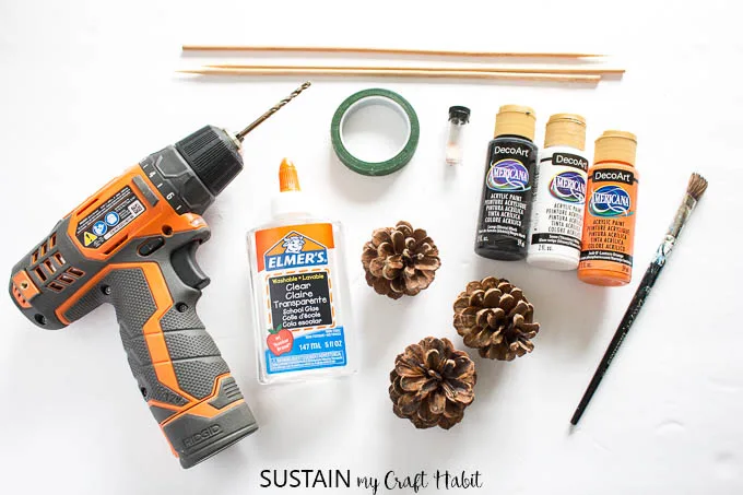 Supplies needed to make Halloween painted pine cone flowers