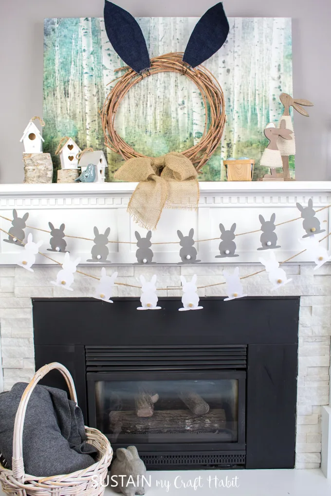 DIY Easter garland or bunny silhouettes strung in front of a fileplace mantle.