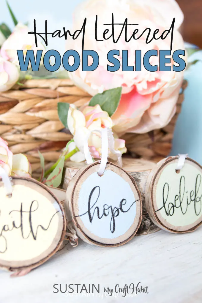 Hand lettered phrases on rustic birch wood slices