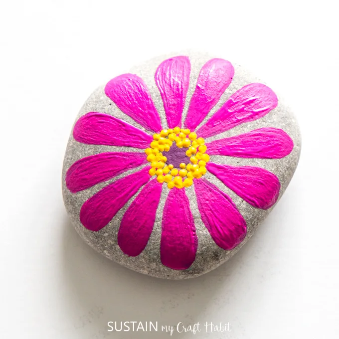 Fully completed pink flower painted rock