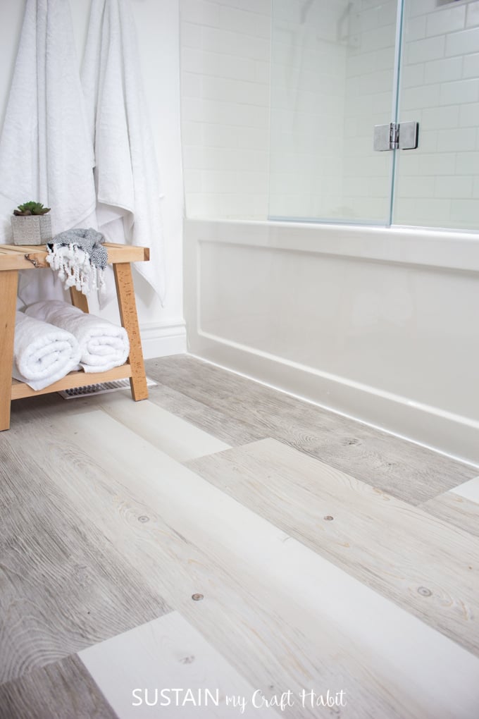 bathroom with vinyl plank flooring wall