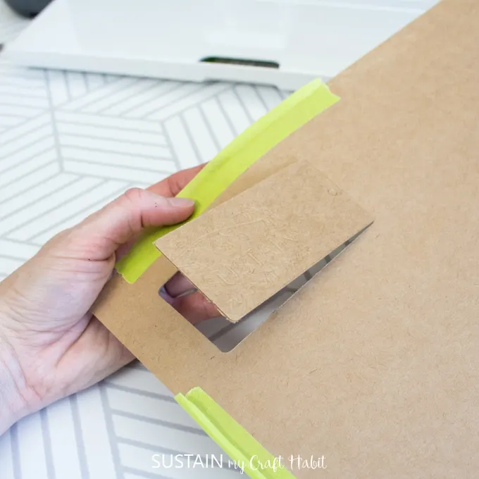 Remove the debossed DIY product tag from the chipboard sheet.