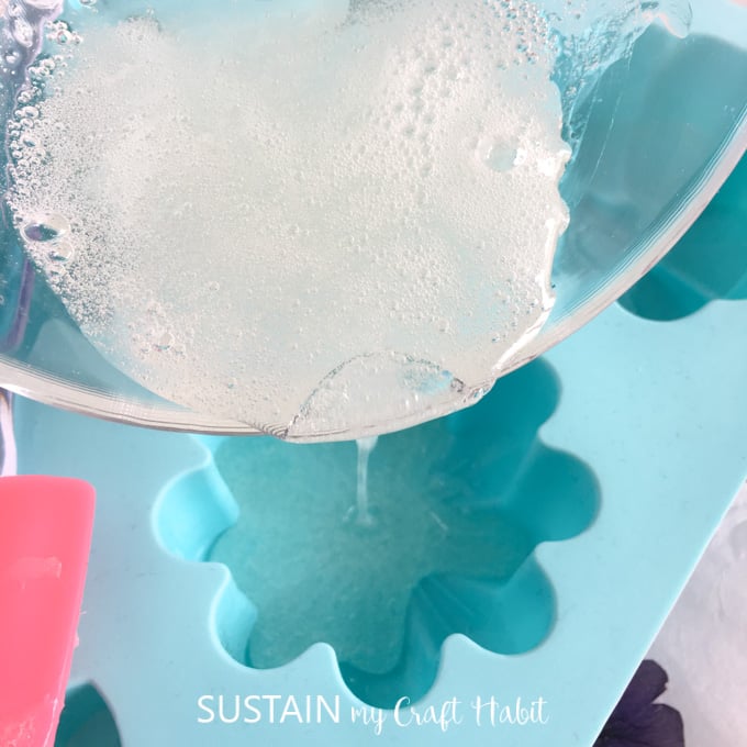 Pouring the melted glycerin soap into the silicone mold.