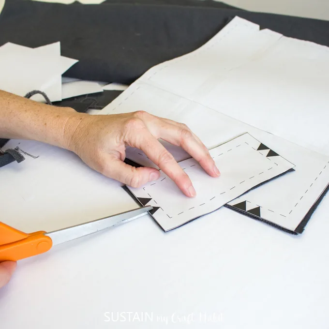 Showing how to snip notches in the fabric pieces for the DIY pencil case sewing tutorial.