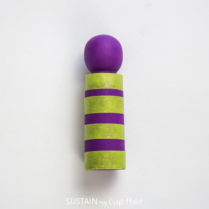 yellow tape wrapped around the purple painted peg.