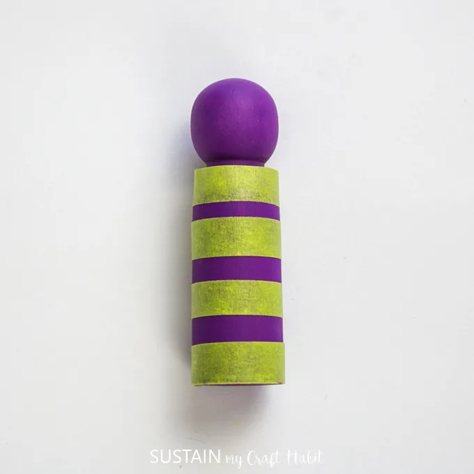 yellow tape wrapped around the purple painted peg.