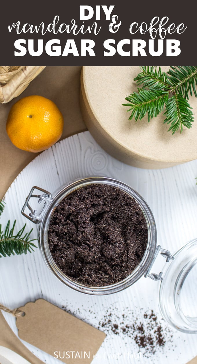 An overhead image of a glass container filled with handmade coffee and mandarin essential oils sugar scrub.