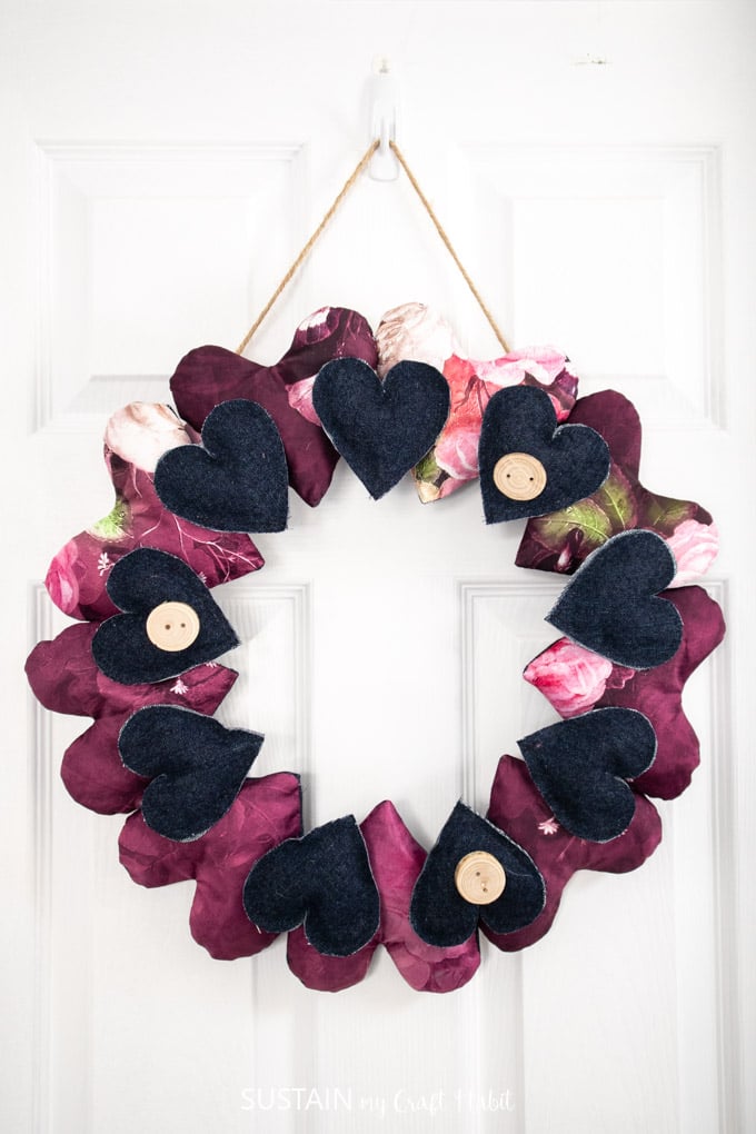 A wreath made with silk and denim fabric hearts.