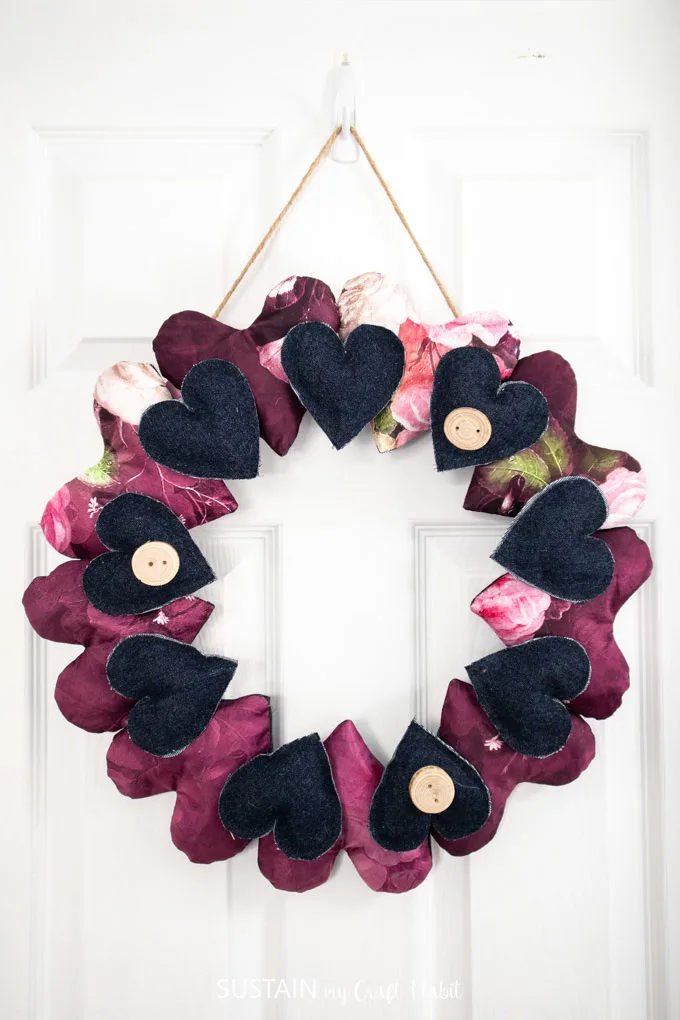 A wreath made with silk and denim fabric hearts.