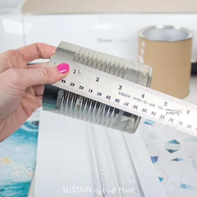 Measure the height of the tin can using a ruler.