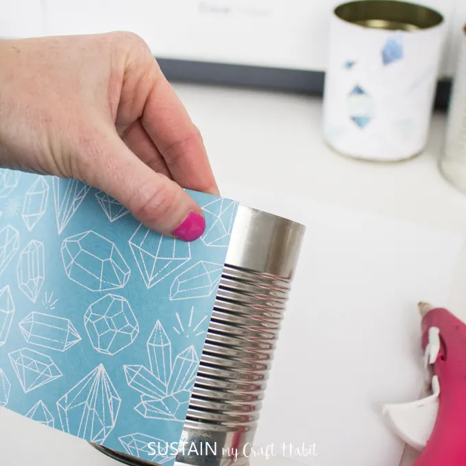 wrap and glue Cricut Deluxe Paper around a tin can
