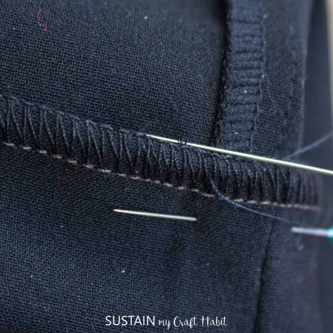 Close up view of a blind stitch hem on a dress pant.