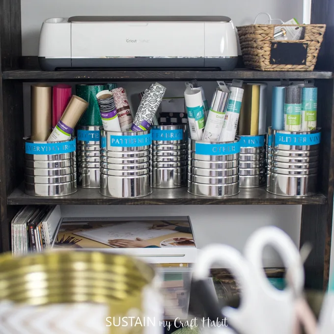 organization labels using Cricut Maker and Premium Vinyl on coffee tins to store Cricut vinyl.