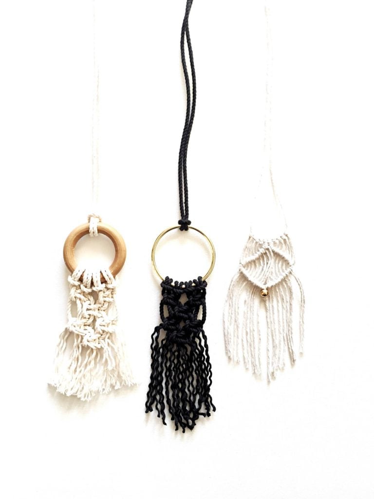 Close up image of 3 necklaces made form this DIY macrame kit.