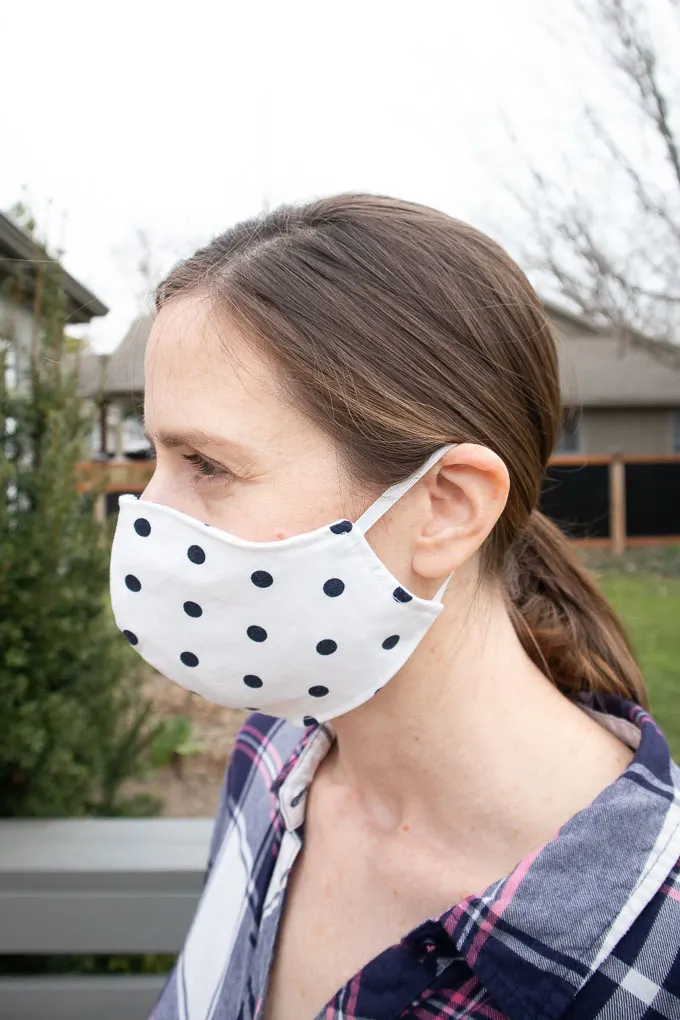 fitted face mask sewn using pattern provided being worn